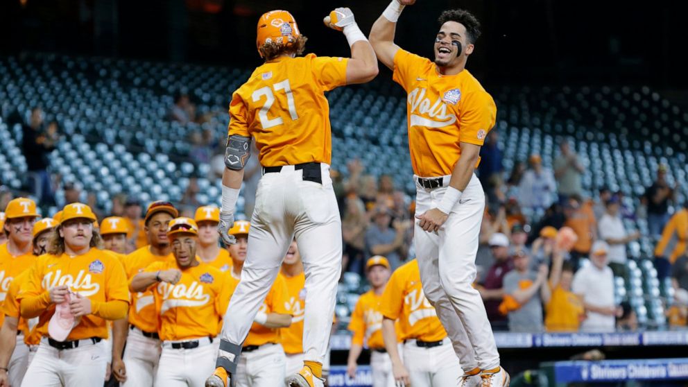 FILE - Tennessee's Jordan Beck (27) and Jorel Ortega, right, jump in celebration of Beck's home run against Oklahoma during an NCAA baseball game on Sunday, March 6, 2022, in Houston. After finishing one of the most dominant runs in Southeastern Conf