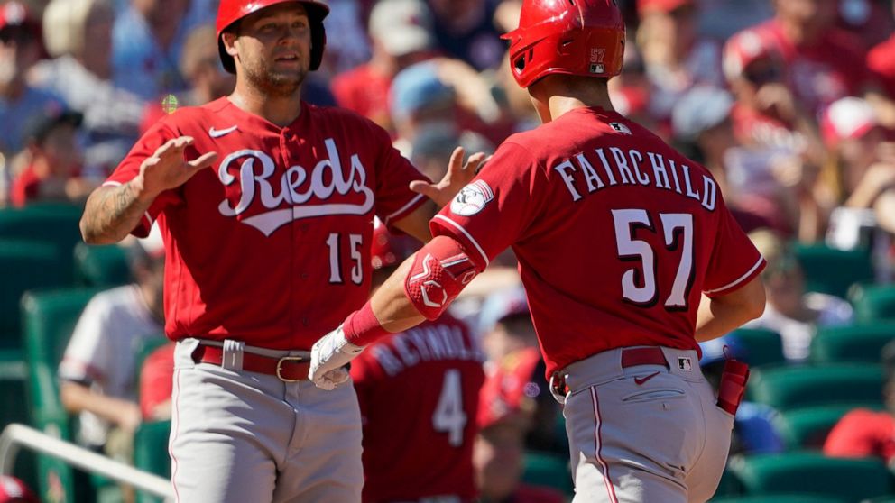 Cincinnati Reds' Stuart Fairchild (57) is congratulated by teammate Nick Senzel (15) after hitting a two-run home run during the sixth inning of a baseball game against the St. Louis Cardinals Sunday, Sept. 18, 2022, in St. Louis. (AP Photo/Jeff Roberson)