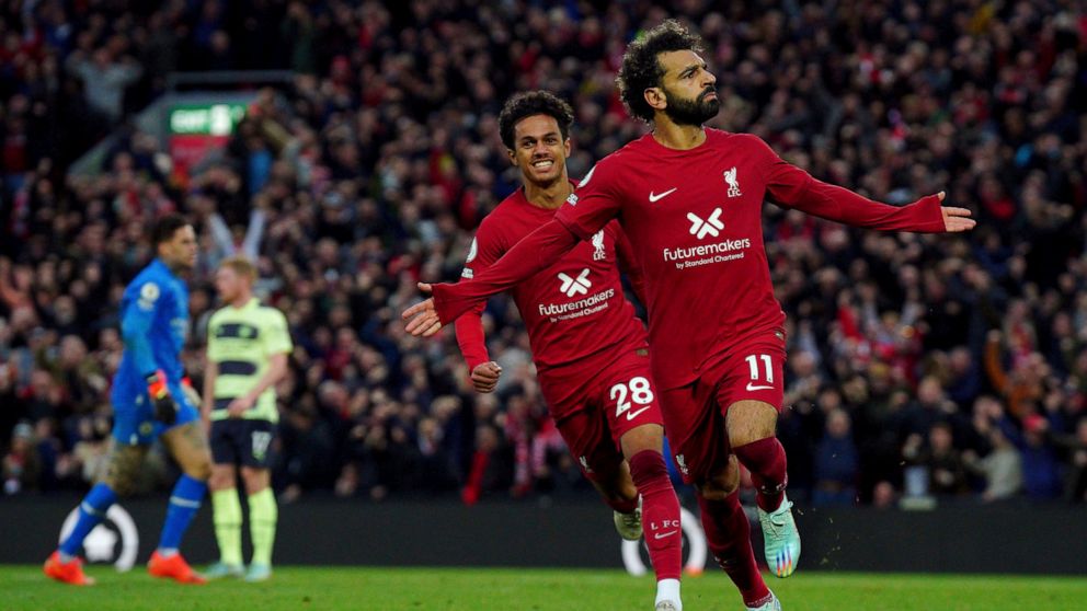 Liverpool's Mohamed Salah celebrates after scoring his side's opening goal during the English Premier League soccer match between Liverpool and Manchester City at Anfield stadium in Liverpool, Sunday, Oct. 16, 2022. (Peter Byrne/PA via AP)