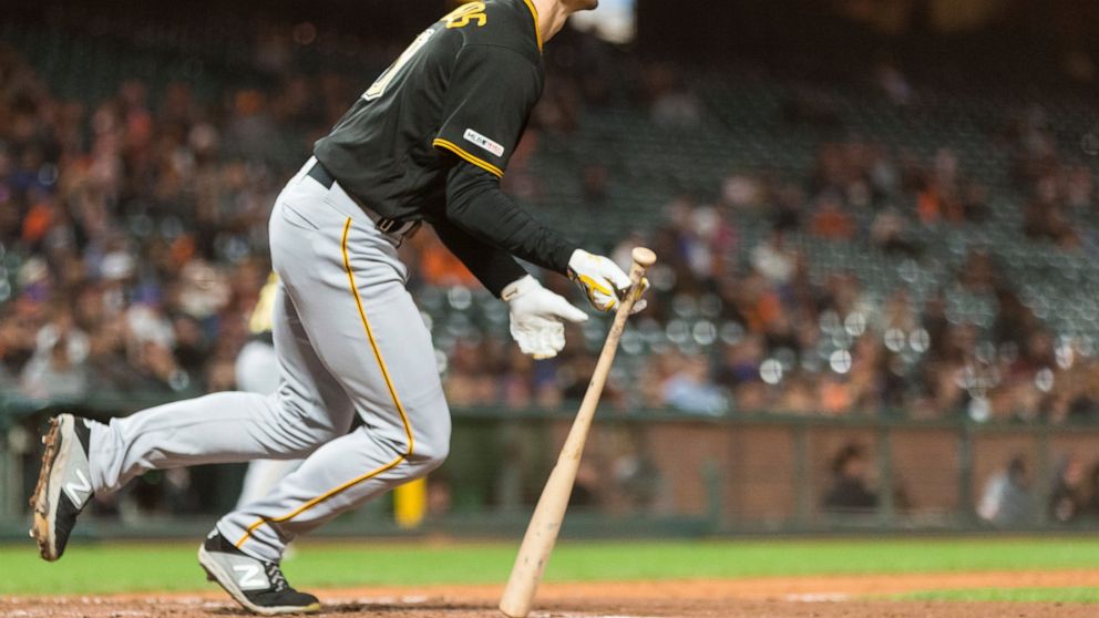 Pittsburgh Pirates' Bryan Reynolds hits a RBI single for the go-ahead run against the San Francisco Giants in the ninth inning of a baseball game in San Francisco, Monday, Sept. 9, 2019. (AP Photo/John Hefti)