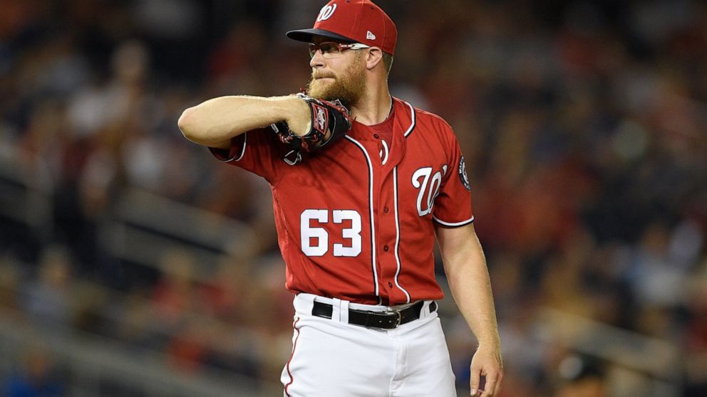 FILE - In this Aug. 17, 2019, file photo, Washington Nationals relief pitcher Sean Doolittle stands on the mound during a baseball game against the Milwaukee Brewers in Washington. At the suggestion of Washington's director of mental conditioning, Ma