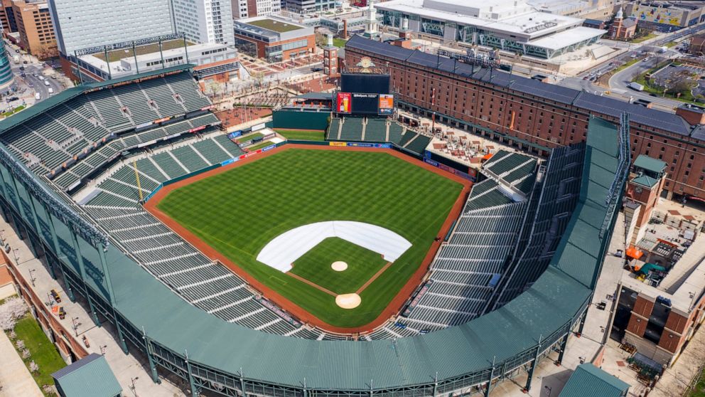 FILE - In this Thursday, March 26, 2020, file photo, Oriole Park at Camden Yards is closed on what would've been Opening Day in Baltimore, Md. Whenever baseball returns because of the coronavirus pandemic, there's an element that might come into play
