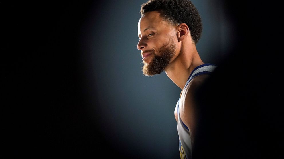 Golden State Warriors guard Stephen Curry poses for a photograph during an NBA basketball media day in San Francisco, Sunday, Sept. 25, 2022. (AP Photo/Godofredo A. Vásquez)