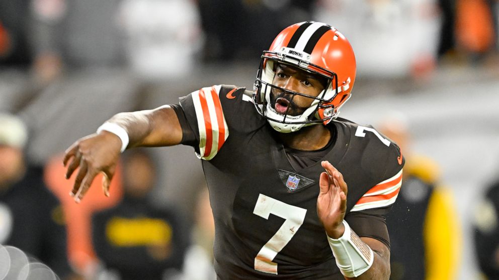 Cleveland Browns quarterback Jacoby Brissett follows through on an 11-yard touchdown pass to Amari Cooper during the first half of the team's NFL football game against the Pittsburgh Steelers in Cleveland, Thursday, Sept. 22, 2022. (AP Photo/David Ri
