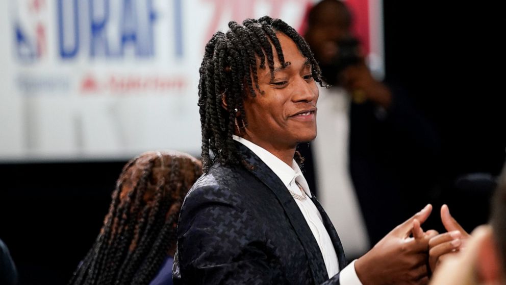 TyTy Washington Jr. reacts after being selected 29th overall by the Memphis Grizzlies in the NBA basketball draft, Thursday, June 23, 2022, in New York. (AP Photo/John Minchillo)