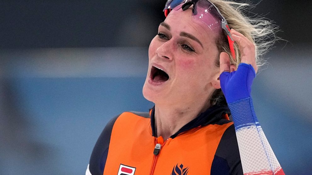 Irene Schouten of the Netherlands reacts after wining the gold medal and setting an Olympic record in the women's speedskating 5,000-meter race at the 2022 Winter Olympics, Thursday, Feb. 10, 2022, in Beijing. (AP Photo/Sue Ogrocki)