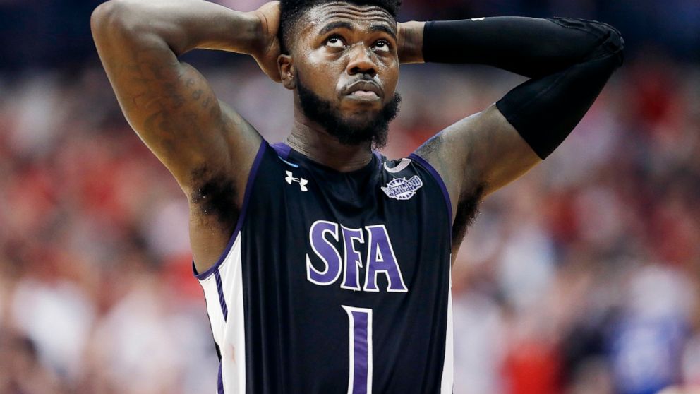 FILE - In this Thursday, March 15, 2018, file photo, Stephen F. Austin guard Kevon Harris (1) reacts after losing to Texas Tech during the first-round game at the NCAA college basketball tournament in Dallas. The rule adopted by the NCAA amid the col
