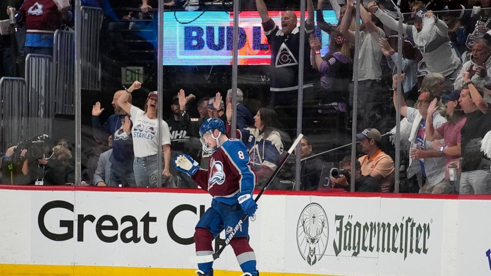 Colorado Avalanche defenseman Cale Makar celebrates his goal against the Tampa Bay Lightning during the third period in Game 2 of the NHL hockey Stanley Cup Final, Saturday, June 18, 2022, in Denver. (AP Photo/John Locher)