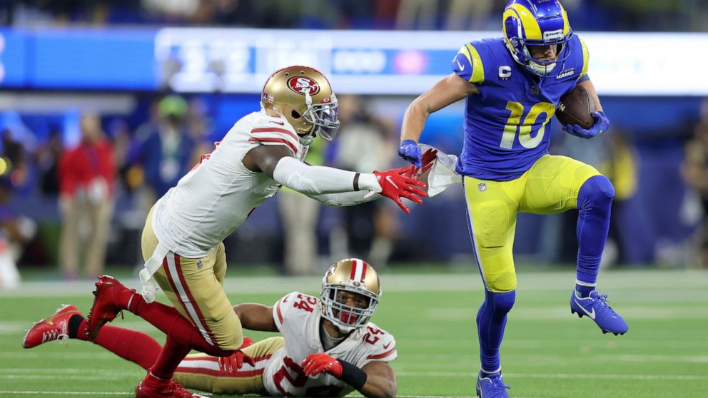 Los Angeles Rams' Cooper Kupp (10) gets past San Francisco 49ers' Jaquiski Tartt, left, and K'Waun Williams (24) during the second half of the NFC Championship NFL football game Sunday, Jan. 30, 2022, in Inglewood, Calif. (AP Photo/Jed Jacobsohn)