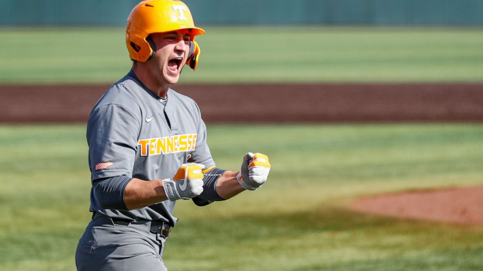 FILE -Tennessee outfielder Evan Russell (6) reacts to hitting a home run during an NCAA college baseball super regional game against LSU Sunday, June 13, 2021, in Knoxville, Tenn. Tennessee's Evan Russell has been cleared to play in an NCAA Tournamen