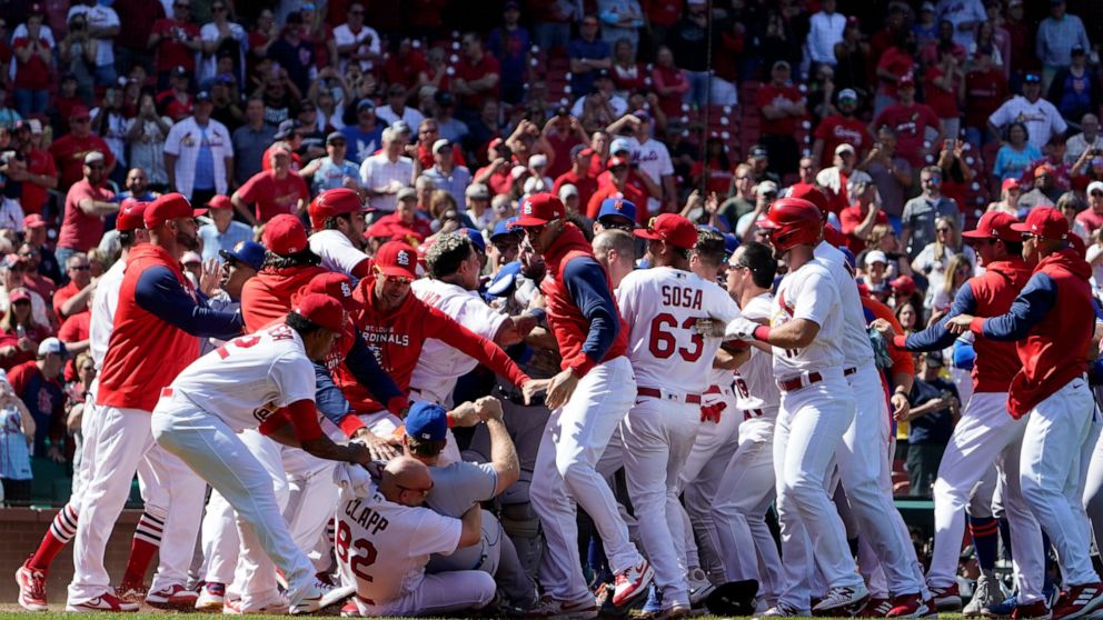 Benches clear during the eighth inning of a baseball game between the St. Louis Cardinals and the New York Mets Wednesday, April 27, 2022, in St. Louis. (AP Photo/Jeff Roberson)
