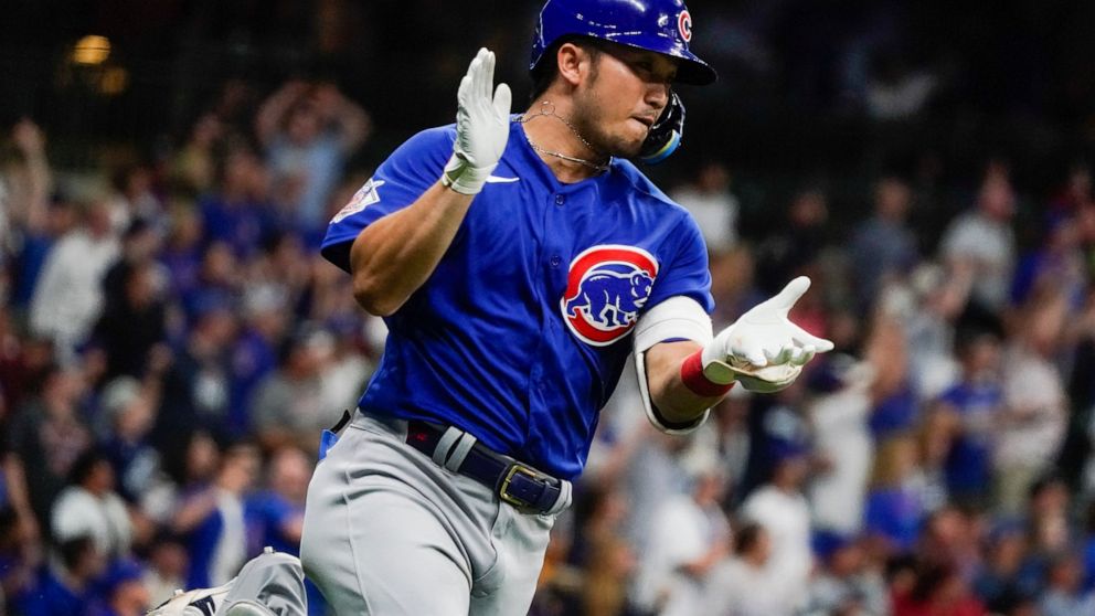 Chicago Cubs' Seiya Suzuki reacts after hitting a two-run home run during the fifth inning of a baseball game against the Milwaukee Brewers Tuesday, July 5, 2022, in Milwaukee. (AP Photo/Morry Gash)