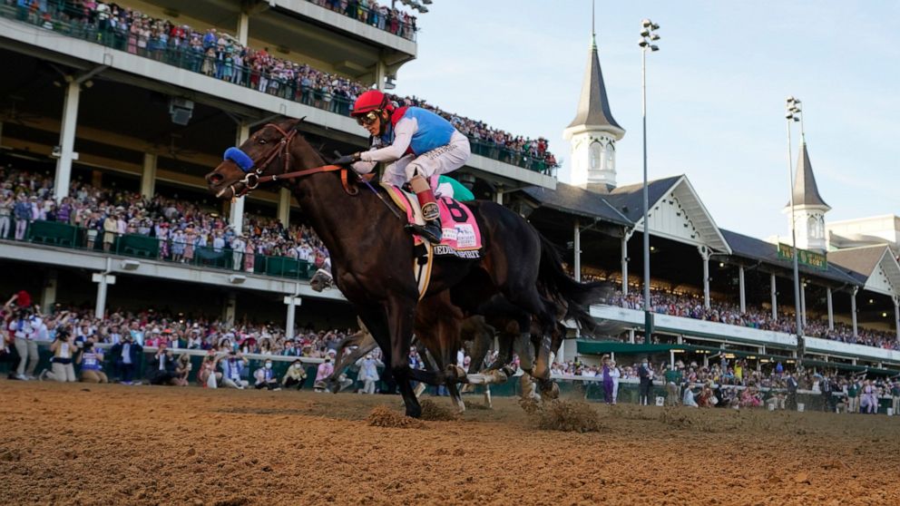 FILE - John Velazquez riding Medina Spirit crosses the finish line to win the 147th running of the Kentucky Derby at Churchill Downs in Louisville, Ky., in this Saturday, May 1, 2021, file photo. Medina Spirit was stripped of the victory in last year