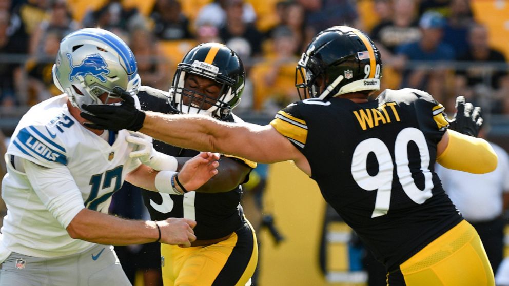 Pittsburgh Steelers linebacker T.J. Watt (90) gets a hand on Detroit Lions quarterback Tim Boyle (12) as he pressures him during the first half of an NFL preseason football game, Sunday, Aug. 28, 2022, in Pittsburgh. No penalty was called. (AP Photo/