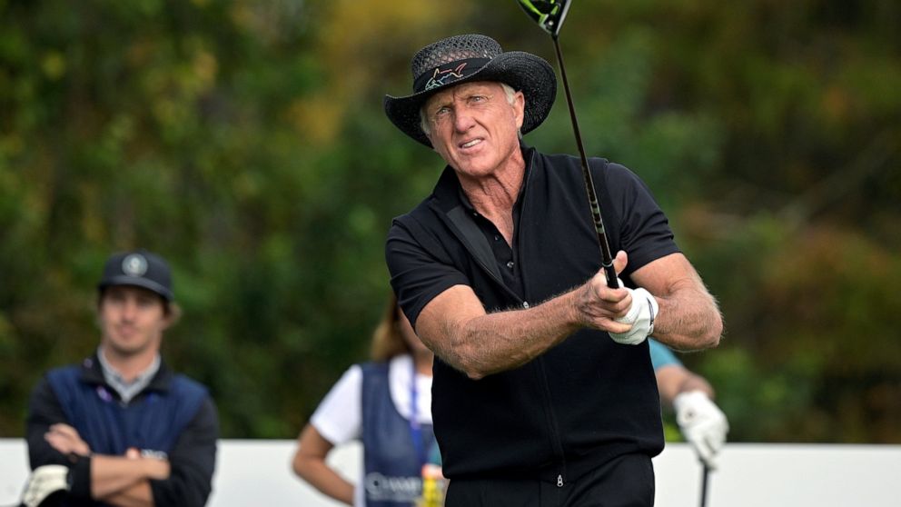 FILE - Greg Norman, of Australia, watches his tee shot on the first hole during the final round of the PNC Championship golf tournament on Dec. 20, 2020, in Orlando, Fla. Norman is heading up a Saudi-backed company that plans 10 new tournaments on th