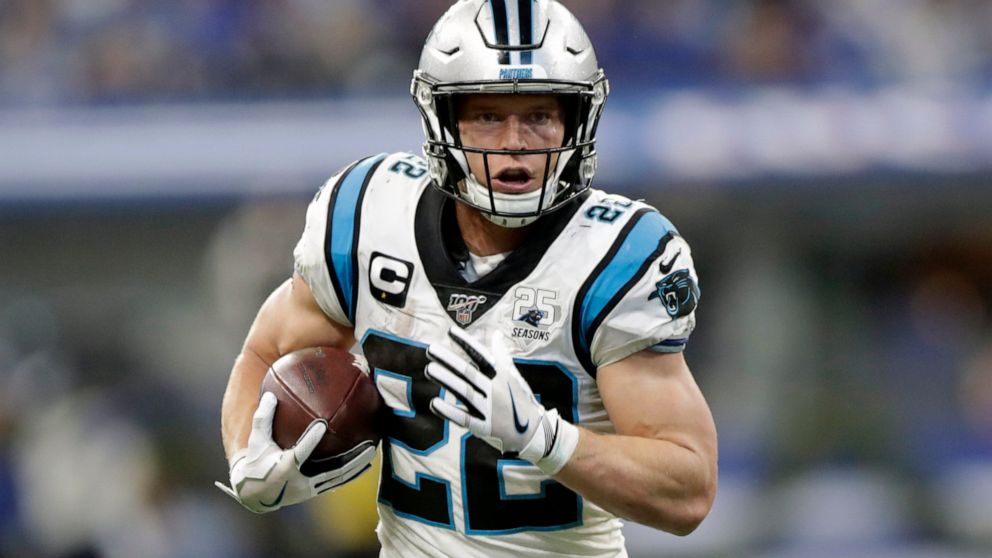 FILE - In this Dec. 22, 2019, file photo, Carolina Panthers' Christian McCaffrey runs during the second half of an NFL football game against the Indianapolis Colts, in Indianapolis. McCaffrey's versatility and superb statistics helped him to a rare d