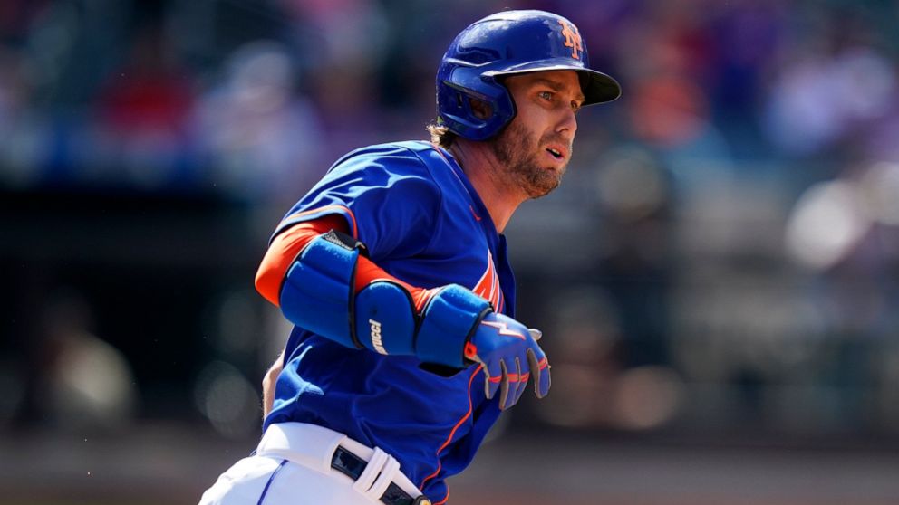 New York Mets' Jeff McNeil watches the ball he hit for an RBI double as he runs to second base during the third inning in the first baseball game of a doubleheader against the St. Louis Cardinals Tuesday, May 17, 2022, in New York. (AP Photo/Frank Fr