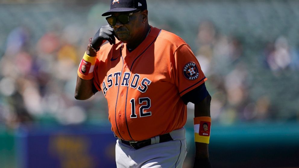 Houston Astros manager Dusty Baker Jr. walks toward the dugout after making a pitching change during the seventh inning of his team's baseball game against the Oakland Athletics in Oakland, Calif., Wednesday, July 27, 2022. (AP Photo/Jeff Chiu)