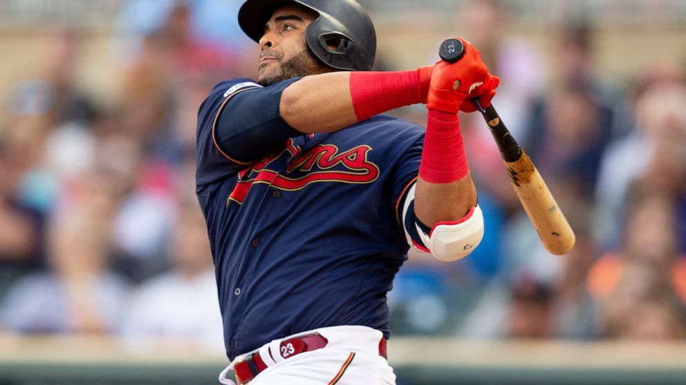 Minnesota Twins' Nelson Cruz hits a double against the Boson Red Sox in the first inning of a baseball game Monday, June 17, 2019, in Minneapolis. (AP Photo/Andy Clayton- King)