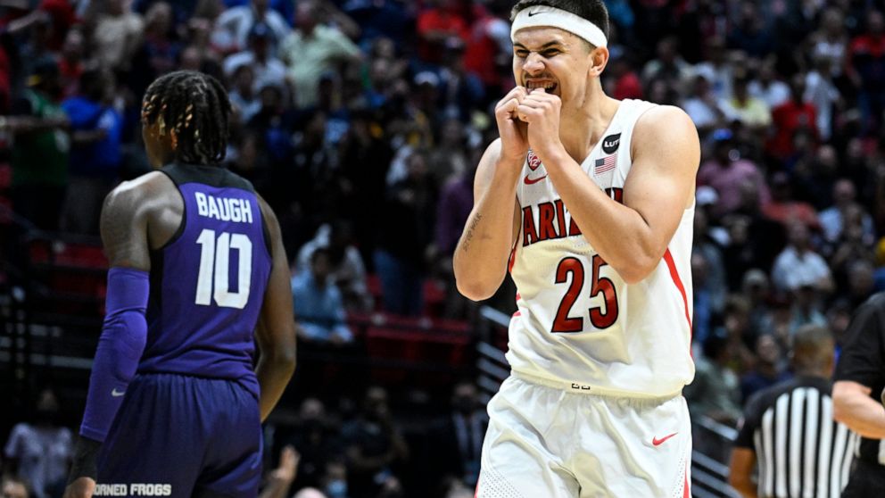 Arizona guard Kerr Kriisa (25) reacts as TCU guard Damion Baugh (10) walks off the court at the end of overtime in a second-round NCAA college basketball tournament game against TCU, Sunday, March 20, 2022, in San Diego. Arizona won 85-80. (AP Photo/