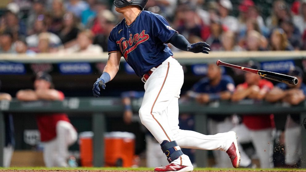 Minnesota Twins' Gio Urshela watches his walkoff two-run home run during the bottom of the tenth inning of a baseball game against the Detroit Tigers in Minneapolis, Monday, Aug. 1, 2022. (AP Photo/Abbie Parr)