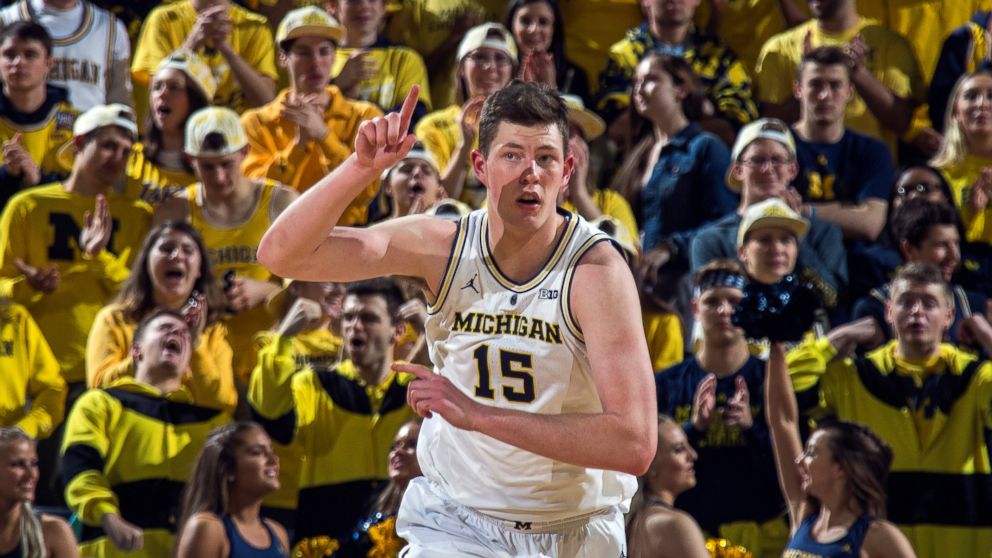 Michigan center Jon Teske (15) reacts after making a basket in the first half of an NCAA college basketball game against Northwestern at Crisler Center in Ann Arbor, Mich., Sunday, Jan. 13, 2019. (AP Photo/Tony Ding)