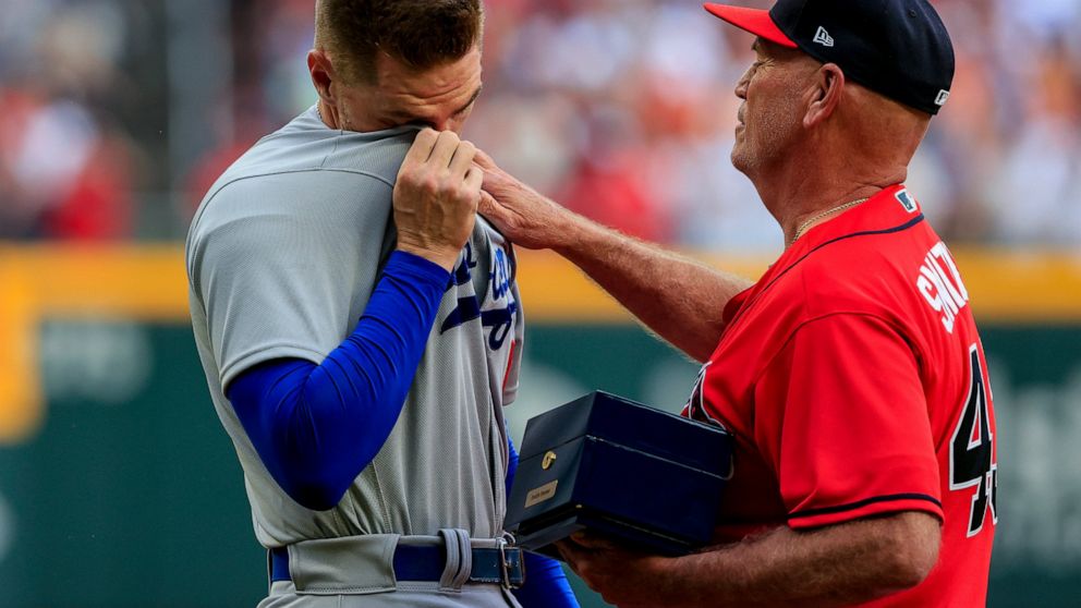 Emotional Freeman given ovation, ring 