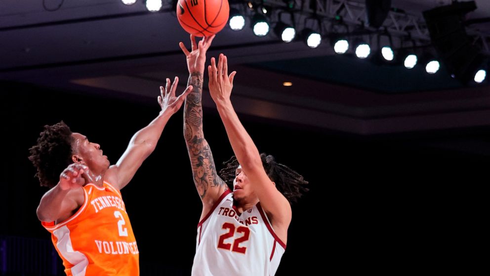 In a photo provided by Bahamas Visual Services, Southern California's Tre White (22) shoots over Tennessee's Julian Phillip's (2) during an NCAA college basketball game in the Battle 4 Atlantis at Paradise Island, Bahamas, Thursday, Nov. 24, 2022. (T