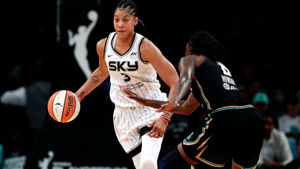 Chicago Sky forward Candace Parker (3) drives to the basket against New York Liberty forward Natasha Howard (6) during the first half of a WNBA basketball playoff game Tuesday, Aug. 23, 2022, in New York. (AP Photo/Noah K. Murray)