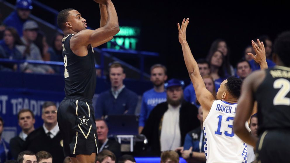 Vanderbilt's Joe Toye, left, shoots while defended by Kentucky's Jemarl Baker (13) during the first half of an NCAA college basketball game in Lexington, Ky., Saturday, Jan. 12, 2019. (AP Photo/James Crisp)