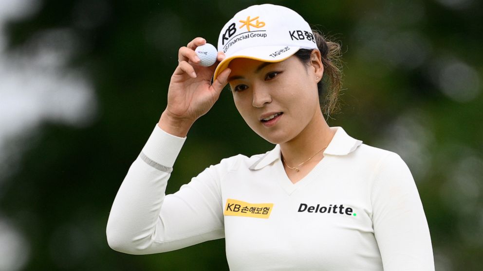 In Gee Chun, of South Korea, holds her ball after finishing her round on the ninth hole during the first round in the Women's PGA Championship golf tournament at Congressional Country Club, Thursday, June 23, 2022, in Bethesda, Md. (AP Photo/Nick Wass)