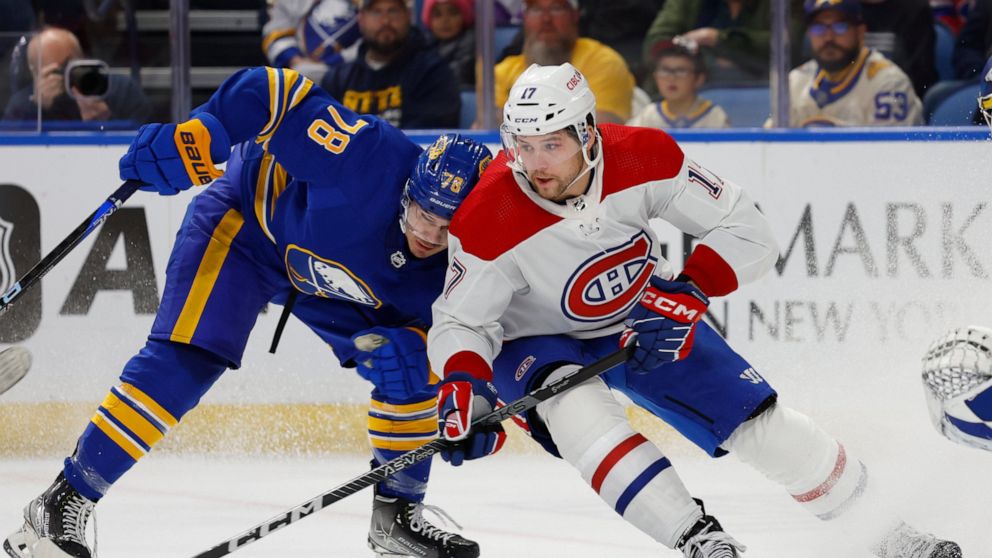 Buffalo Sabres defenseman Jacob Bryson (78) and Montreal Canadiens right wing Josh Anderson (17) battle for position during the second period of an NHL hockey game, Thursday, Oct. 27, 2022, in Buffalo, N.Y. (AP Photo/Jeffrey T. Barnes)