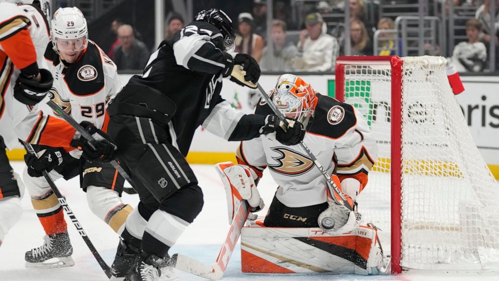 Anaheim Ducks goaltender Lukas Dostal (1) stops a shot by Los Angeles Kings left wing Kevin Fiala (22) during the second period of an NHL hockey game Tuesday, Dec. 20, 2022, in Los Angeles. (AP Photo/Ashley Landis)