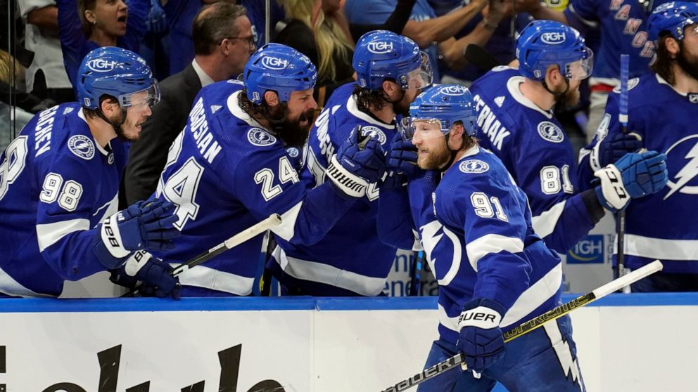 Tampa Bay Lightning center Steven Stamkos (91) celebrates with the bench after his goal against the New York Rangers during the third period in Game 6 of the NHL hockey Stanley Cup playoffs Eastern Conference finals Saturday, June 11, 2022, in Tampa,