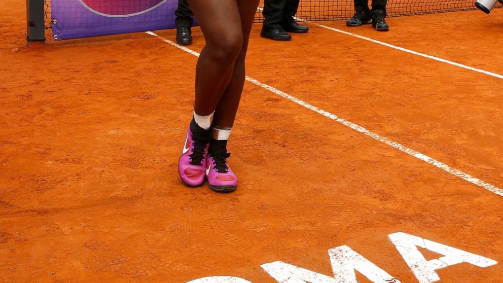 FILE - In this Sunday, May 15, 2016 file photo, Serena Williams poses with the trophy after beating Madison Keys 7-6, 6-3, in the final match of the Italian Open tennis tournament, in Rome. Serena Williams is set to return from injury at the upcoming