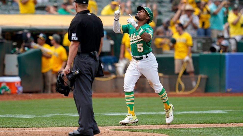 Oakland Athletics' Tony Kemp (5) celebrates after hitting a solo home run against the Chicago White Sox during the sixth inning of a baseball game in Oakland, Calif., Sunday, Sept. 11, 2022. (AP Photo/Godofredo A. Vásquez)