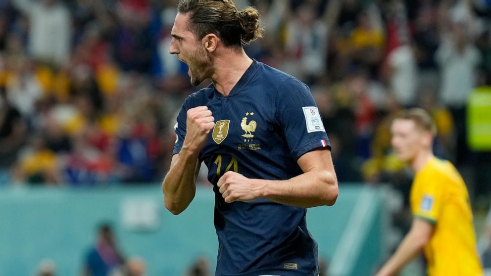 France's Adrien Rabiot celebrates after scoring his side's opening goal during the World Cup group D soccer match between France and Australia, at the Al Janoub Stadium in Al Wakrah, Qatar, Tuesday, Nov. 22, 2022. (AP Photo/Francisco Seco)