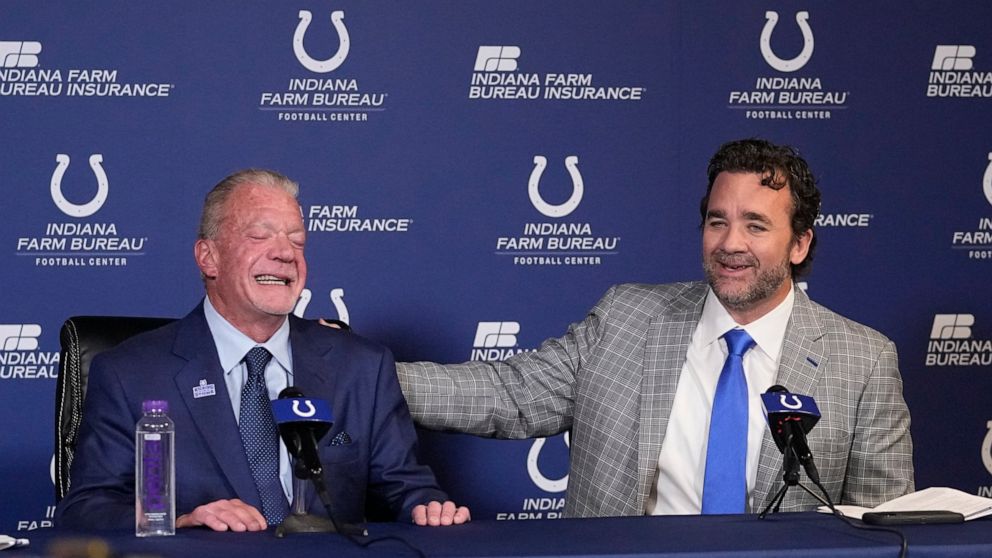 Indianapolis Colts interim coach Jeff Saturday speaks while team owner Jim Irsay listens during a news conference at the NFL football team's practice facility Monday, Nov. 7, 2022, in Indianapolis. (AP Photo/Darron Cummings)