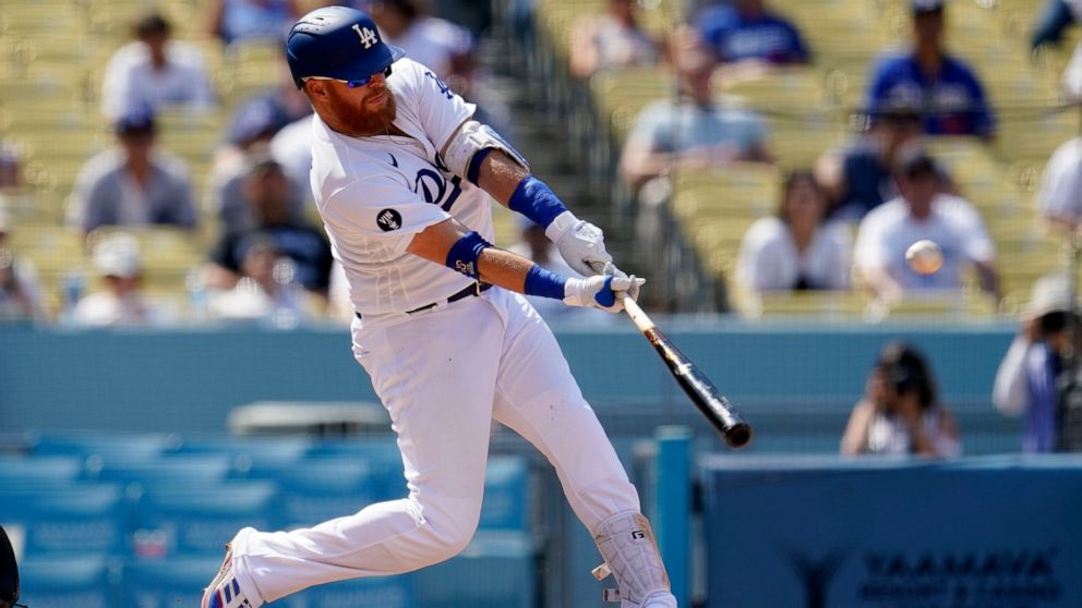 Los Angeles Dodgers' Justin Turner connects for a three-run home run during the fifth inning of a baseball game against the San Francisco Giants, Wednesday, Sept. 7, 2022, in Los Angeles. (AP Photo/Marcio Jose Sanchez)