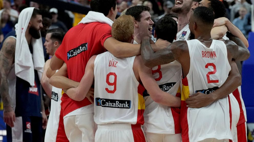 The players of team Spain celebrate winning the Eurobasket final basketball match between Spain and France in Berlin, Germany, Sunday, Sept. 18, 2022. Spain defeated France by 88-76. (AP Photo/Michael Sohn)