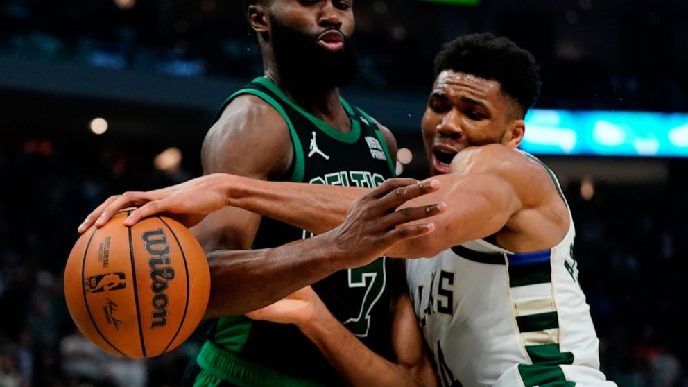 Milwaukee Bucks' Giannis Antetokounmpo and Boston Celtics' Jaylen Brown battle during the first half of Game 4 of an NBA basketball Eastern Conference semifinals playoff series Monday, May 9, 2022, in Milwaukee. (AP Photo/Morry Gash)