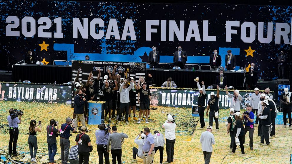 Baylor players and coaches celebrate after the championship game against Gonzaga in the men's Final Four NCAA college basketball tournament, Monday, April 5, 2021, at Lucas Oil Stadium in Indianapolis. Baylor won 86-70. (AP Photo/Darron Cummings)