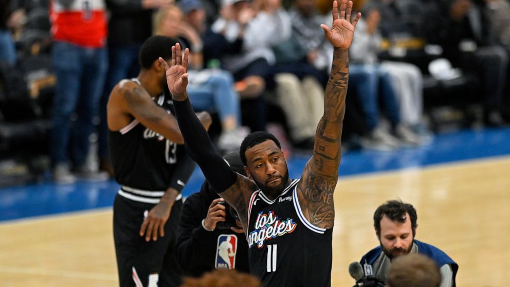 Los Angeles Clippers guard John Wall (11) acknowledges the crowd during the first quarter of the team's NBA basketball game against the Washington Wizards, Saturday, Dec. 10, 2022, in Washington. (AP Photo/Terrance Williams)