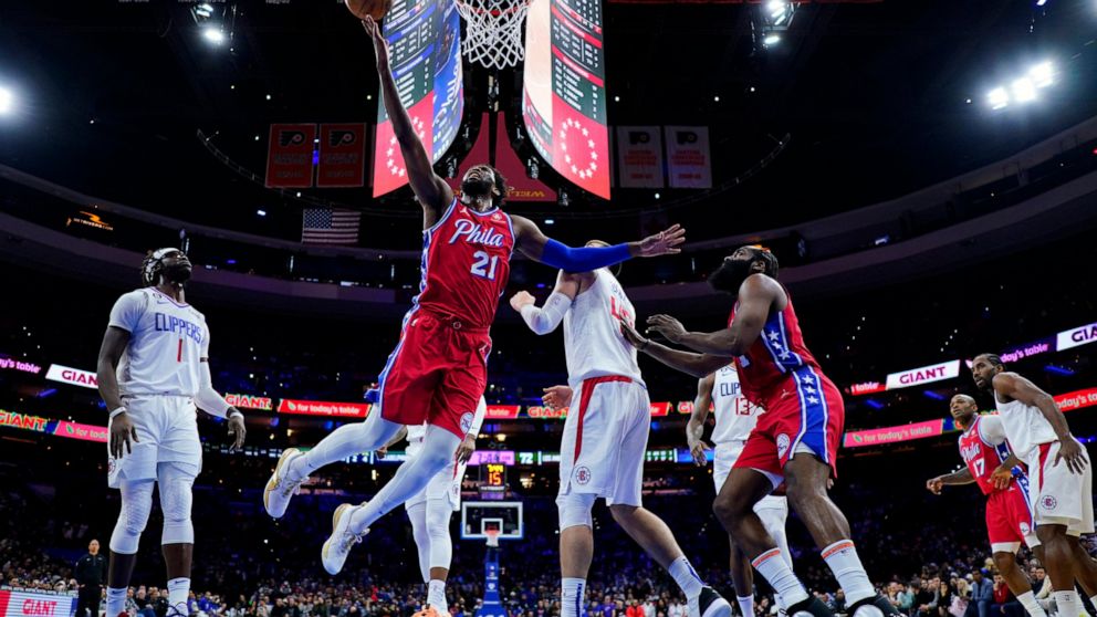 Philadelphia 76ers' Joel Embiid (21) goes up for a shot during the second half of an NBA basketball game against the Los Angeles Clippers, Friday, Dec. 23, 2022, in Philadelphia. (AP Photo/Matt Slocum)