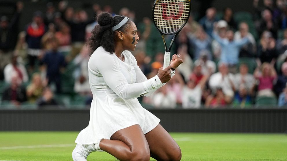 Serena Williams of the US celebrates after winning a point against France's Harmony Tan in a first round women's singles match on day two of the Wimbledon tennis championships in London, Tuesday, June 28, 2022. (AP Photo/Alberto Pezzali)