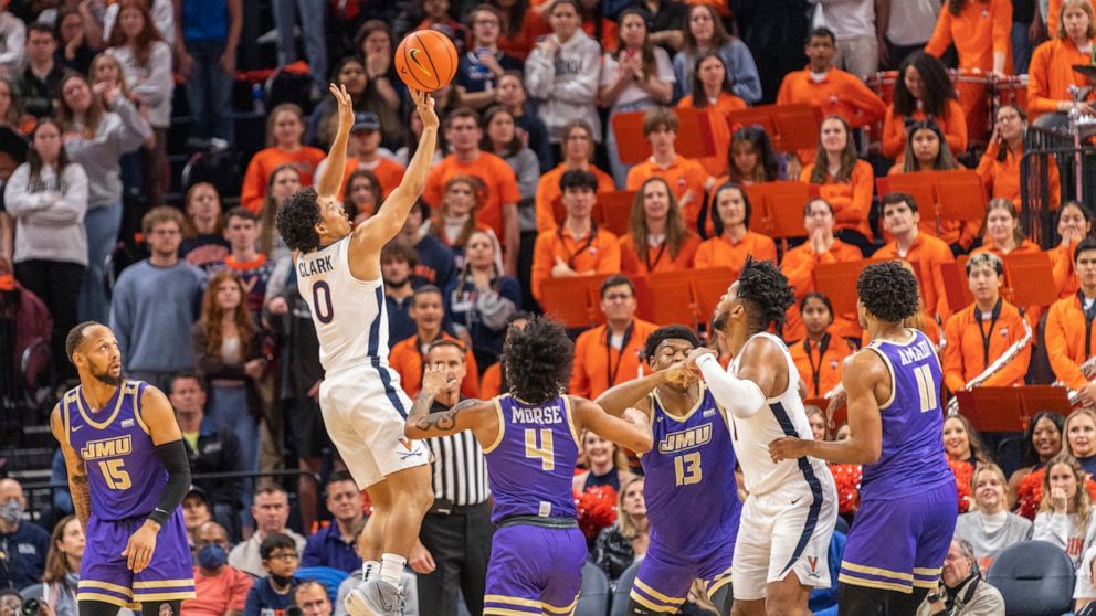 Virginia guard Kihei Clark (0) shoots against James Madison during the first half of an NCAA college basketball game in Charlottesville, Va., Tuesday, Dec. 6, 2022. (AP Photo/Erin Edgerton)