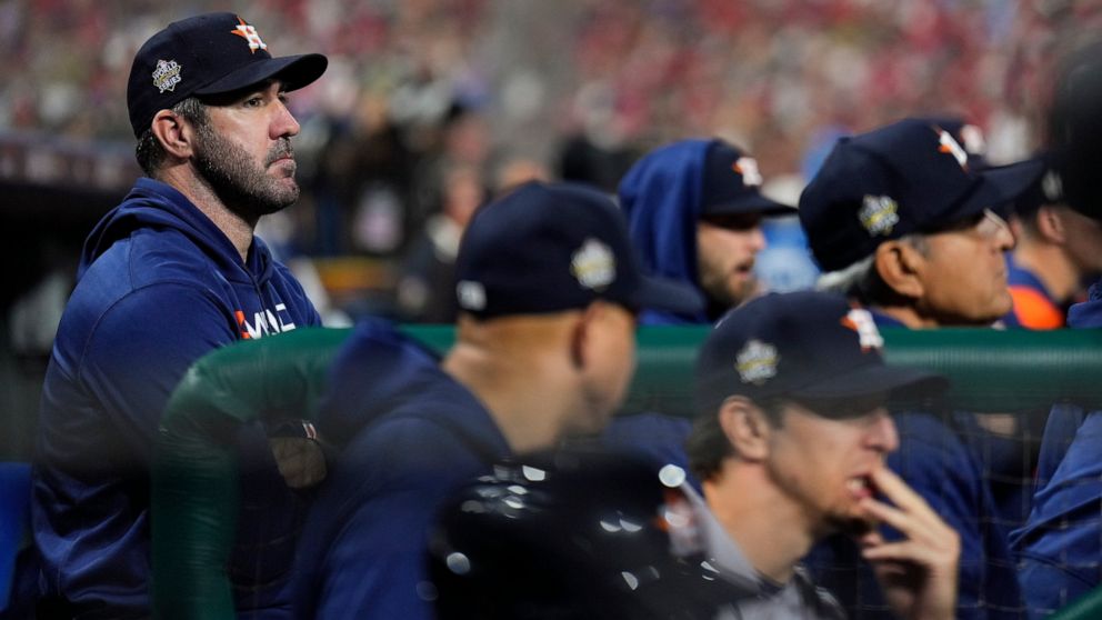 Houston Astros starting pitcher Justin Verlander watches during loss in Game 3 of baseball's World Series between the Houston Astros and the Philadelphia Phillies on Tuesday, Nov. 1, 2022, in Philadelphia. (AP Photo/Matt Slocum)