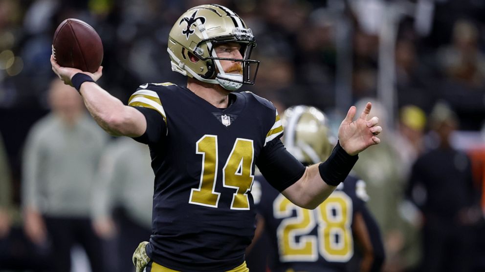New Orleans Saints quarterback Andy Dalton passes against the Los Angeles Rams in the first half of an NFL football game in New Orleans, Sunday, Nov. 20, 2022. (AP Photo/Butch Dill)