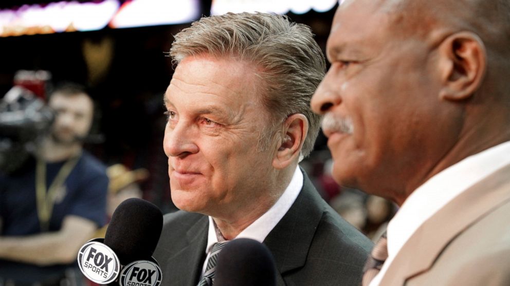 In this Feb. 25, 2014, photo, longtime sportscaster and announcer Fred McLeod works with Austin Carr, right, at a Cleveland Cavaliers game in Cleveland. McLeod has died. He was 67. The Cavaliers said McLeod died suddenly Monday night, Sept. 9, 2019, 