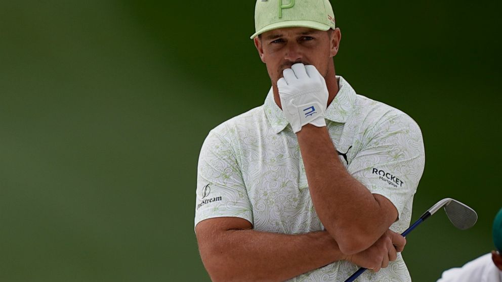 Bryson DeChambeau waits to take his shot to the seventh bunker during the second round at the Masters golf tournament on Friday, April 8, 2022, in Augusta, Ga. (AP Photo/David J. Phillip)